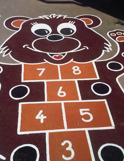 The Brown Bear Hopscotch is a basic grid of hopscotch that has been transformed into a wonderfully bright, colourful and interesting Brown Bear that children are drawn to.