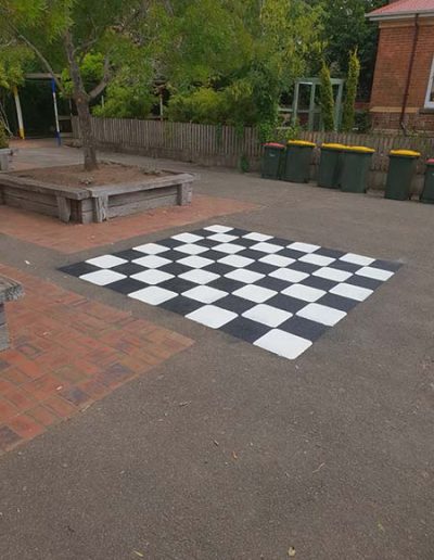 A large chess board in an outdoor setting