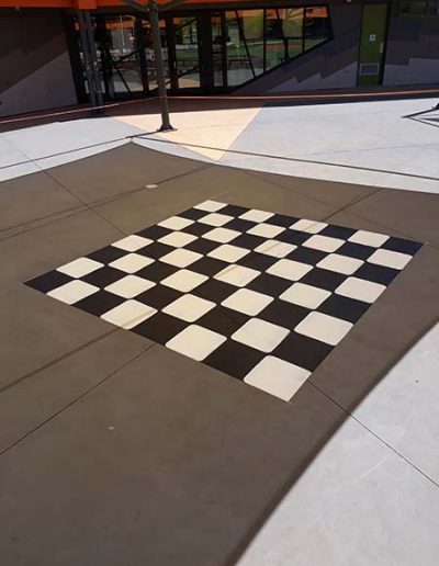 A large chess board in an outdoor setting