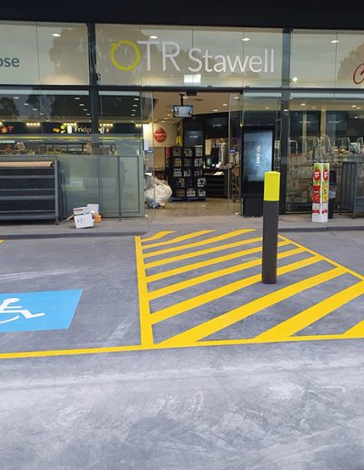 A disabled carpark next to a walkway coming out of a service station store in Stawell Victoria.