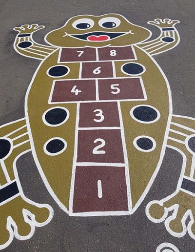 The aboriginal art inspired hopscotch frog allows children to play hopscotch on art inspired by our indigenous culture.