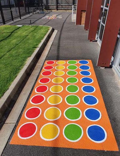 An outdoor twister board with coloured dots is a great motor skills testing out a persons sense of balance, strategy and attention to given instructions.